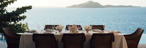 Fiji Destination Wedding - Dining setting for a wedding at Kokomo Private Island Fiji