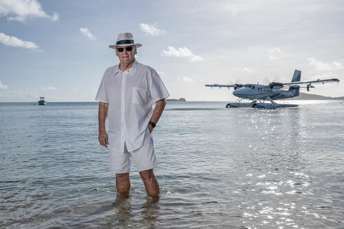 Lang Walker AO on the beach at Kokomo Private Island Fiji