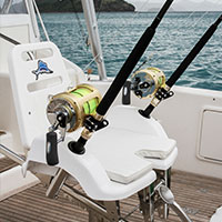 Two large fishing rods waiting to be used on a fishing boat off the coast of Kokomo Private Island Fiji