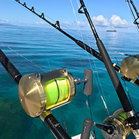 Close up of large fishing reel seat facing the back of the fishing boat off the coast of Kokomo Private Island Fiji