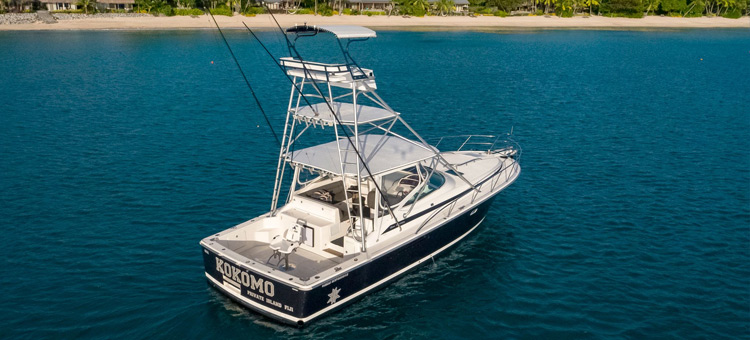 Fishing boat 'Kahala' out on the water off the coast of Kokomo Private Island Fiji