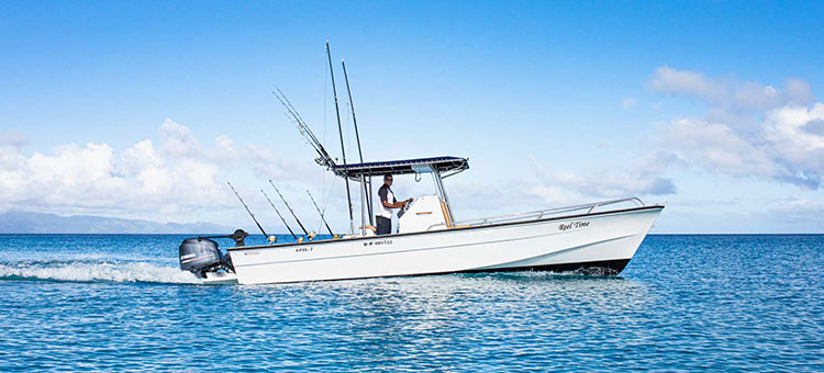 Fishing boat 'Reel time' out on the water off the coast of Kokomo Private Island Fiji