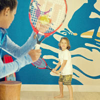 Children playing tennis at Kokomo Private Island