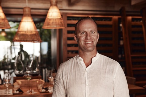 A photo of the Sommellier at one of the curated wine colleciton events at Kokomo Island Fiji