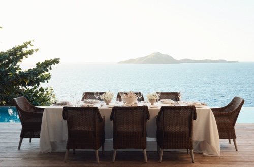 Table set up for dining at one of the grand residences at Kokomo Private Island.
