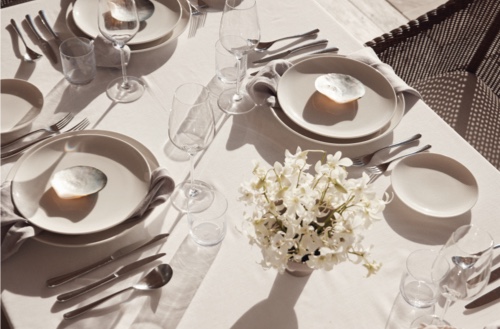 A close up shot of the table setting at one of the tables set up for dining at Kokomo Private Island.