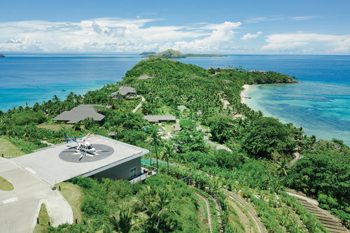 The resident farmer harvesting produce at The Farm at Kokomo Private Island Fiji