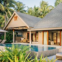 The bedroom of a luxury villa at Kokomo Private Island Fiji.