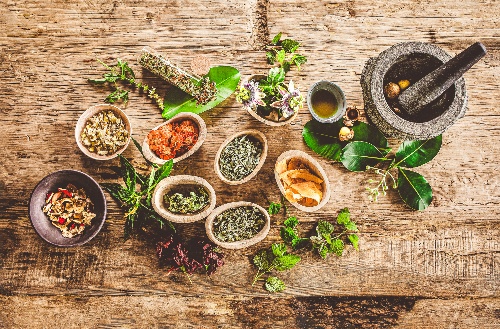 Herbs spices and other natural resources diplayted on a table