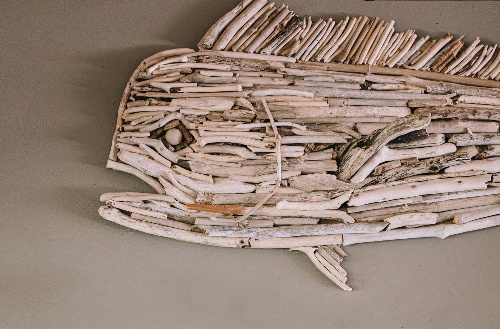 An art piece of game fish made out of sustainably sourced wood