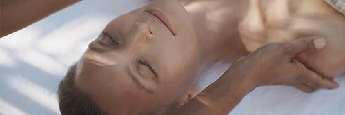 A guest receiving a massage at Kokomo Private Island Fiji.